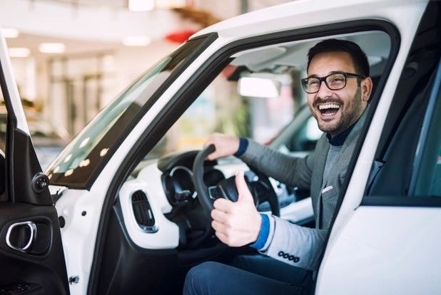 Happy customer in a car
